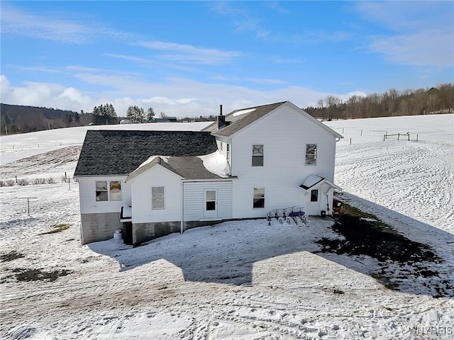 view of snow covered house