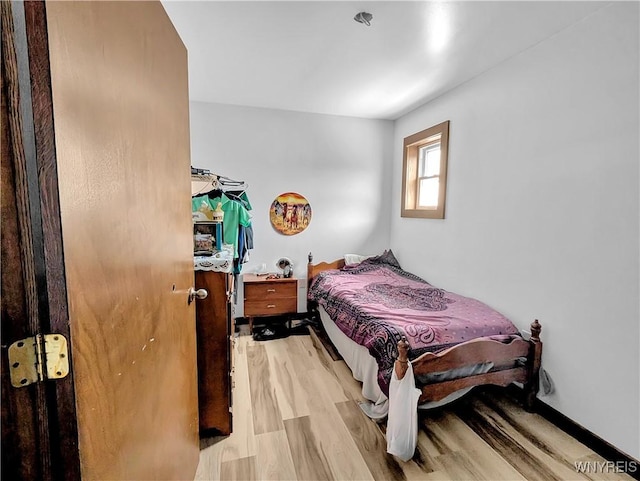 bedroom with light wood finished floors