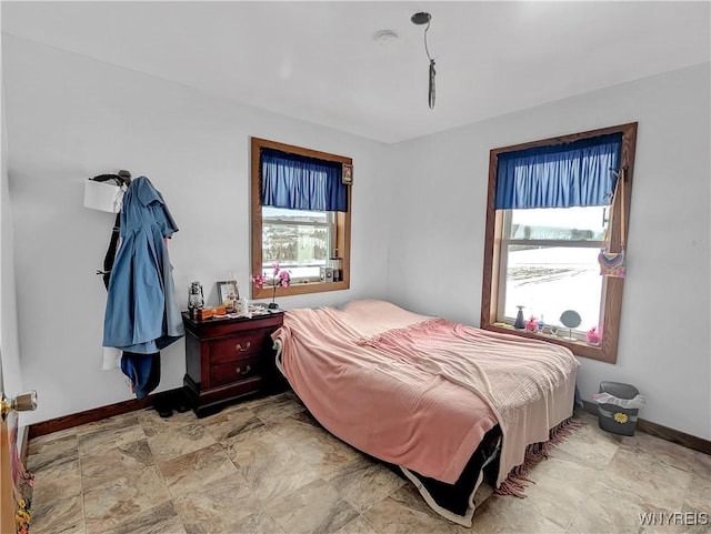 bedroom featuring baseboards