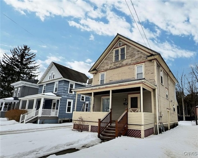 traditional style home featuring covered porch