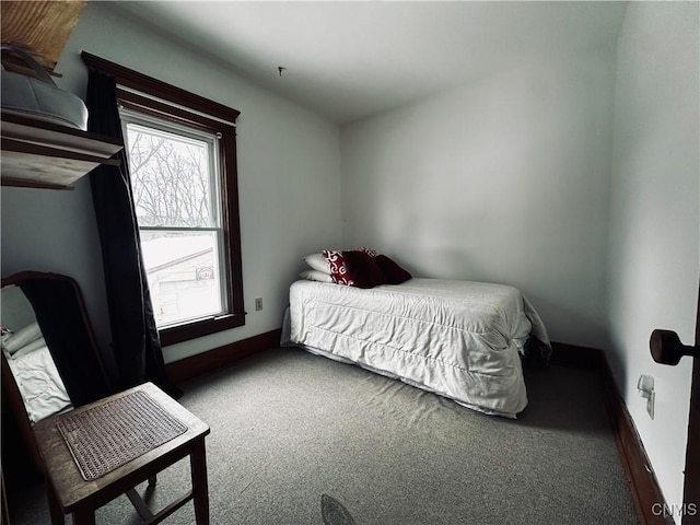 bedroom featuring carpet floors and baseboards