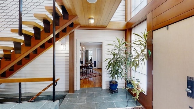 interior space featuring plenty of natural light and stone finish floor