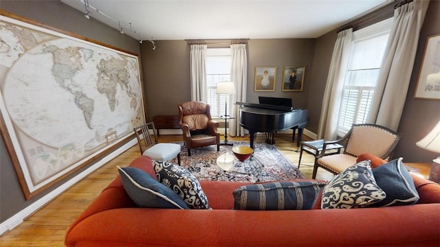 sitting room featuring wood finished floors and baseboards