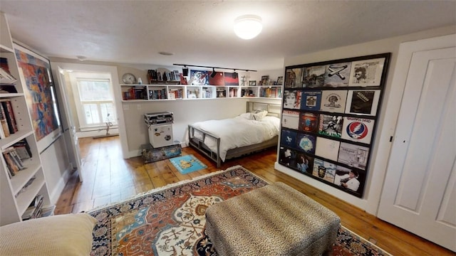 bedroom featuring hardwood / wood-style flooring