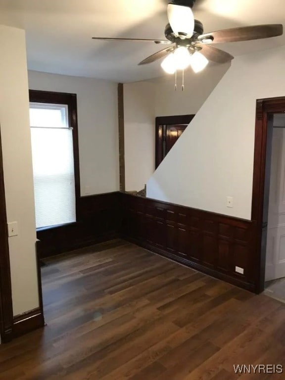 spare room featuring dark wood-style flooring