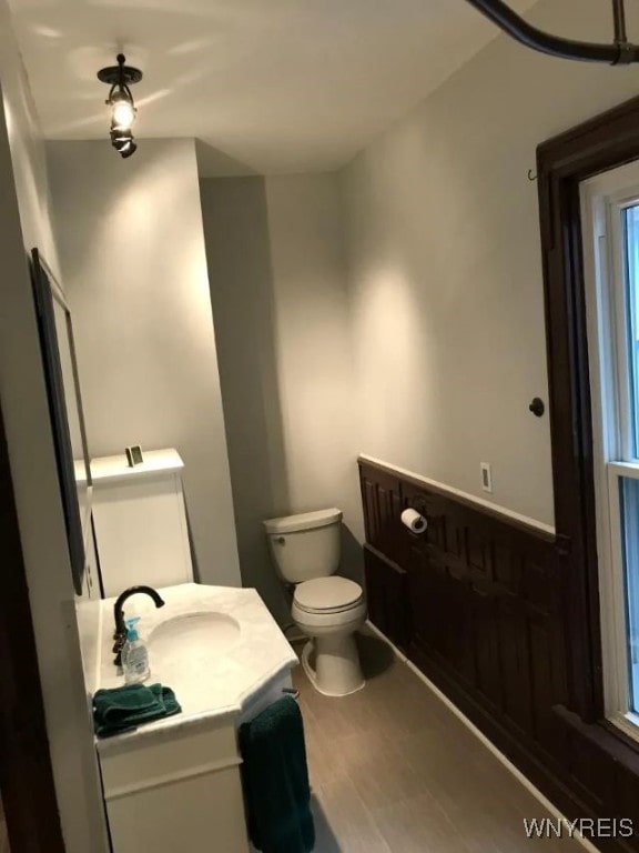 half bath with vanity and toilet