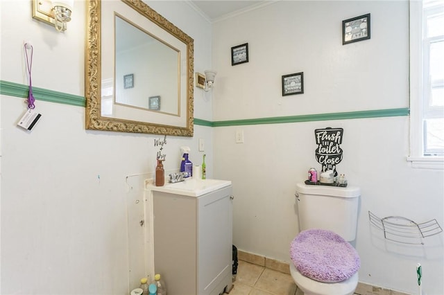 bathroom featuring ornamental molding, vanity, toilet, and tile patterned floors