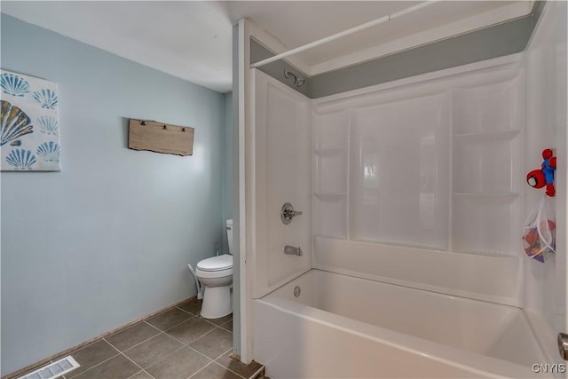 bathroom featuring toilet, shower / washtub combination, visible vents, and tile patterned floors