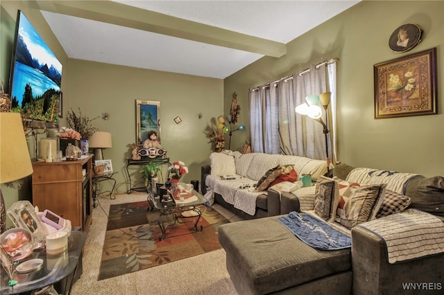 living room with carpet flooring and beamed ceiling