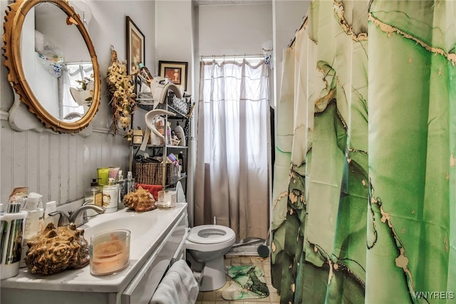 full bath featuring toilet and vanity