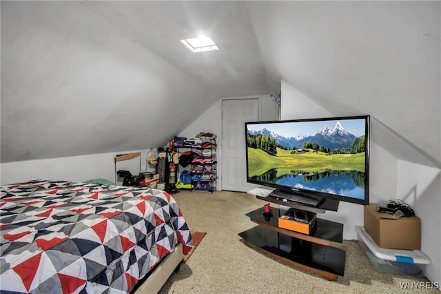 carpeted bedroom featuring lofted ceiling