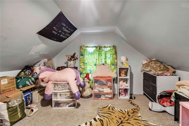 playroom with lofted ceiling and carpet flooring