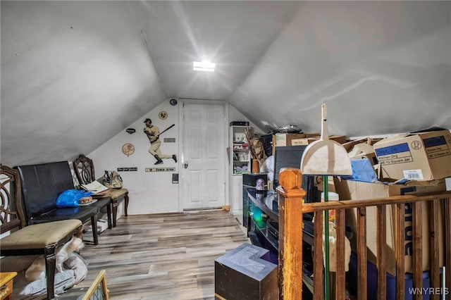 bonus room with lofted ceiling and wood finished floors