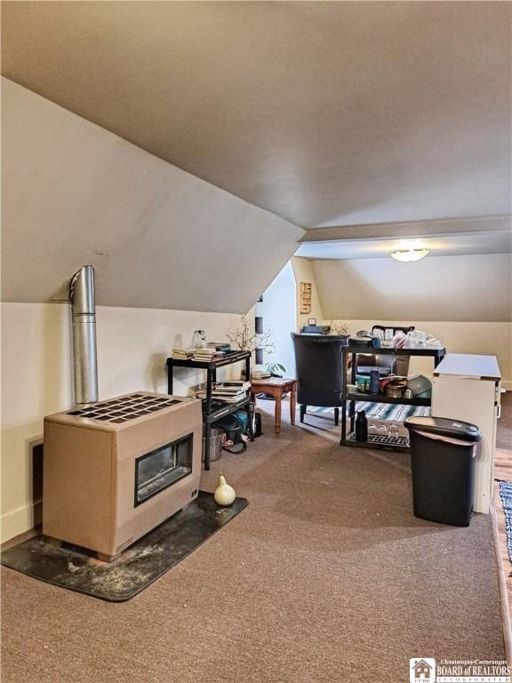 interior space with carpet floors and vaulted ceiling