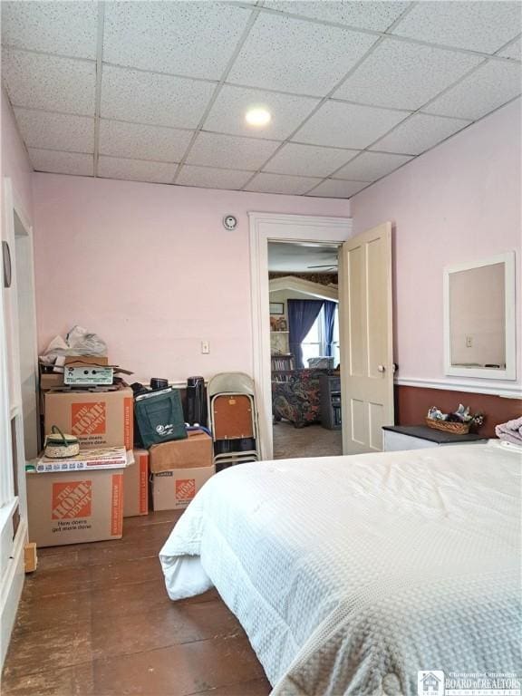 bedroom with a paneled ceiling