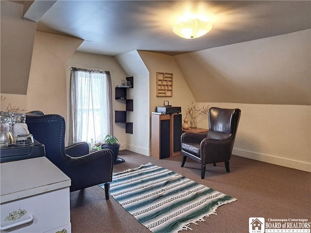 sitting room with lofted ceiling, carpet flooring, and baseboards