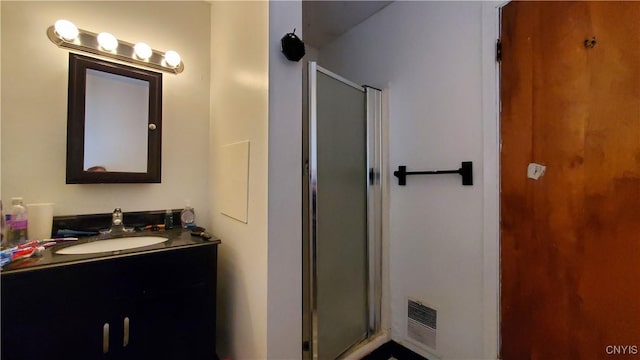 full bath featuring a stall shower and vanity