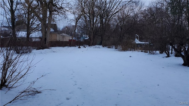 view of yard layered in snow