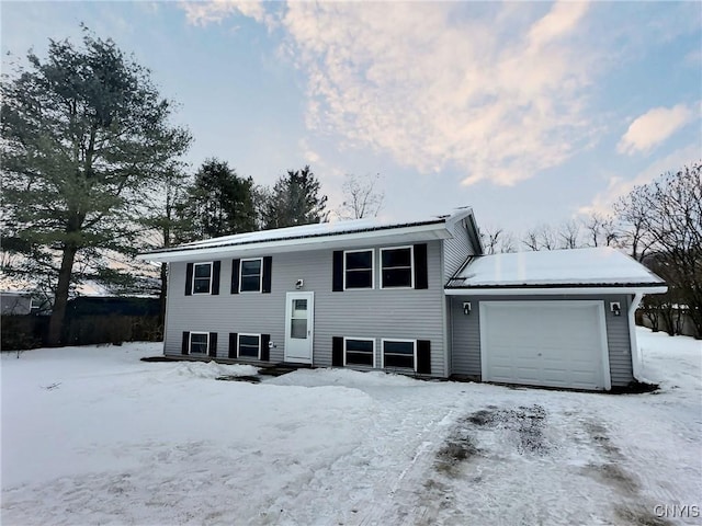 bi-level home featuring an attached garage