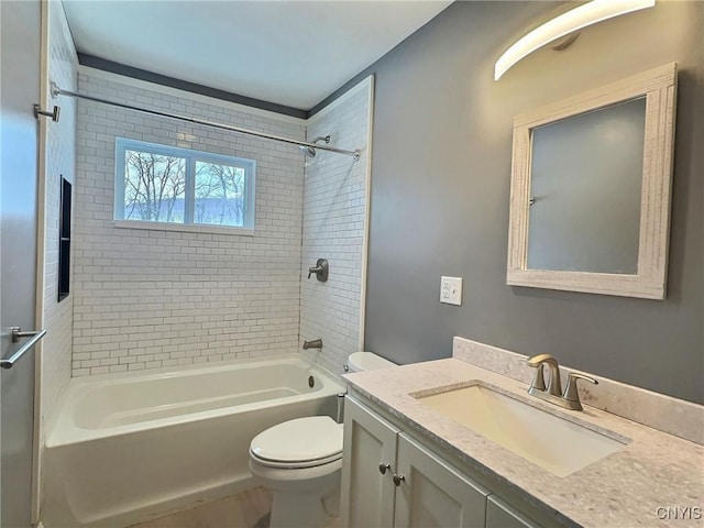 full bath with shower / tub combination, vanity, and toilet