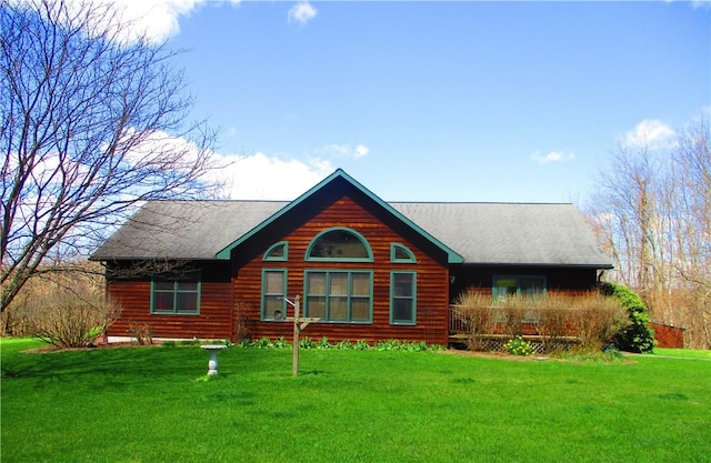 back of house with a lawn