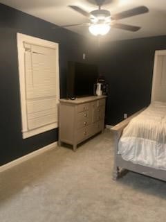 bedroom with ceiling fan and light colored carpet