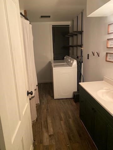 full bath with visible vents, washer / clothes dryer, wood finished floors, and vanity