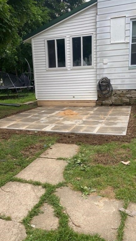 exterior space with a patio and a trampoline