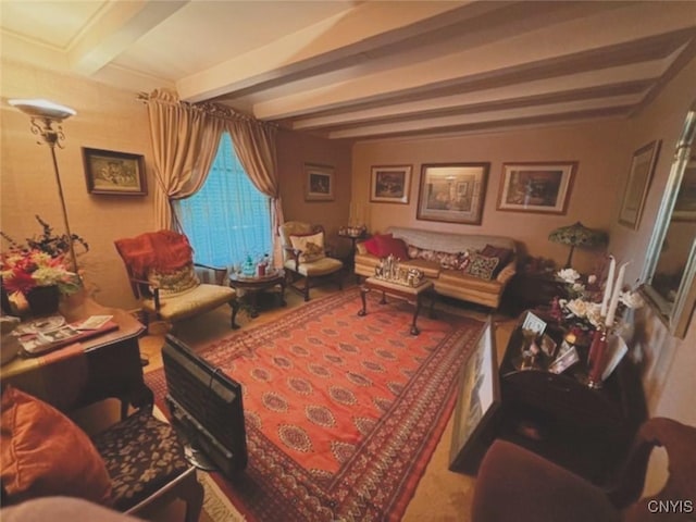 sitting room featuring beam ceiling