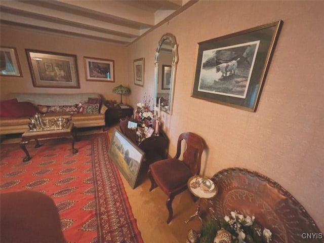 interior space with carpet floors and beam ceiling