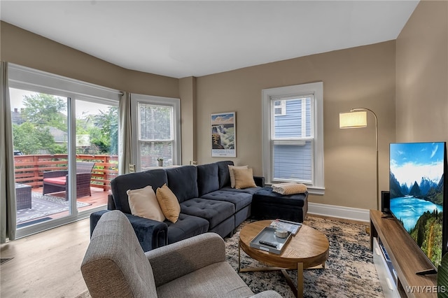 living area featuring wood finished floors and baseboards