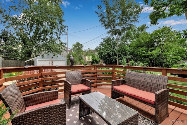 wooden deck with an outbuilding, fence, and an outdoor living space