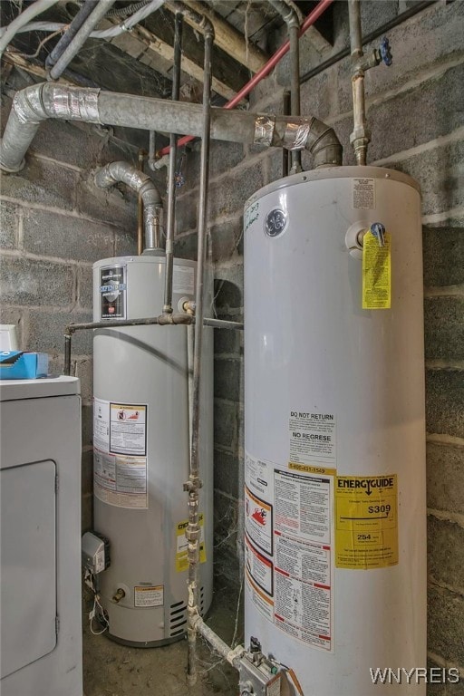 utility room featuring washer / dryer and gas water heater