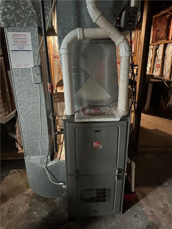 utility room featuring heating unit