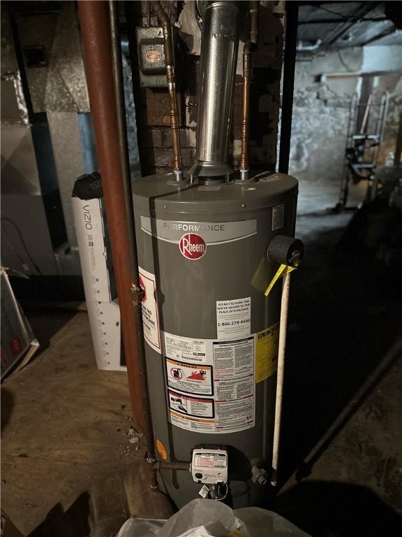 utility room with water heater