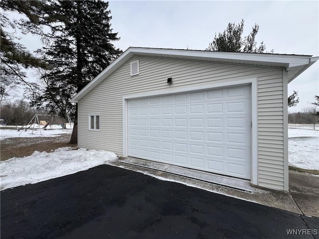 view of snow covered garage