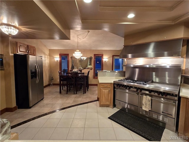 kitchen with light tile patterned floors, stainless steel fridge with ice dispenser, light countertops, an inviting chandelier, and baseboards