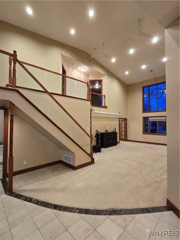 below grade area with tile patterned flooring, visible vents, baseboards, and recessed lighting