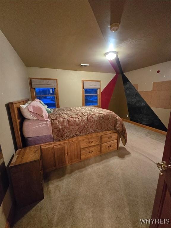 carpeted bedroom featuring visible vents