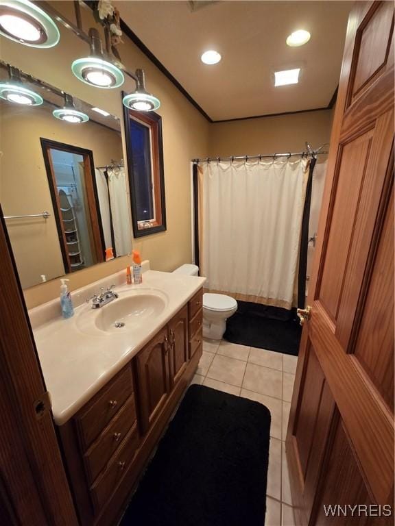 bathroom with recessed lighting, vanity, toilet, and tile patterned floors