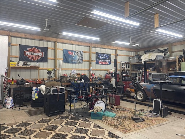 garage with a workshop area and metal wall