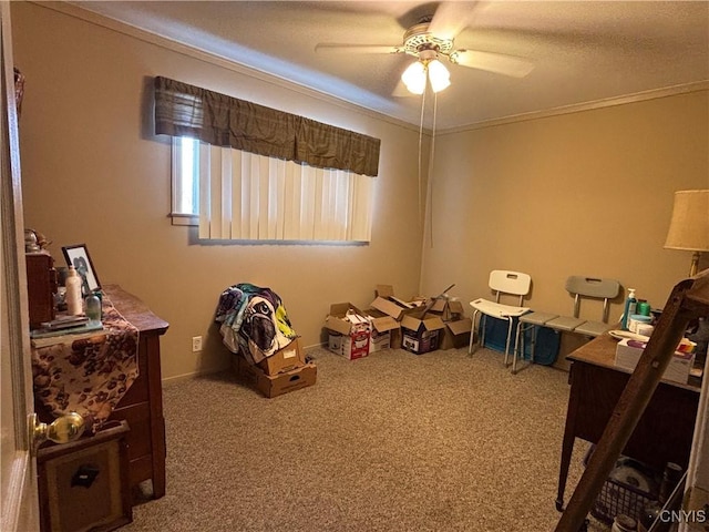 recreation room featuring ornamental molding, carpet floors, and a ceiling fan