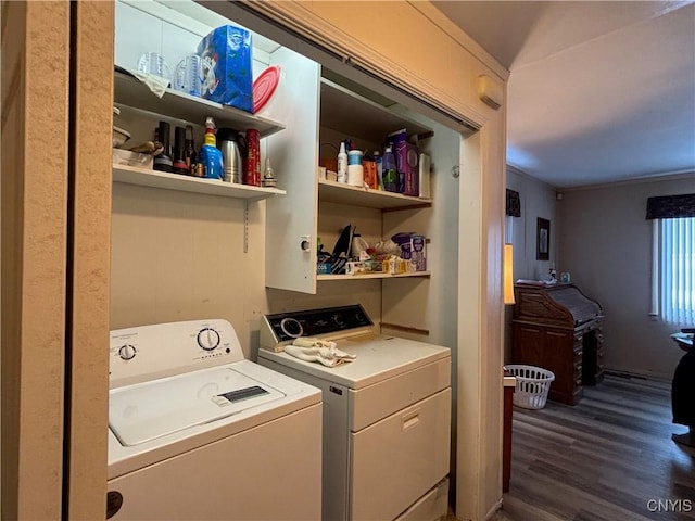 laundry area featuring dark wood-type flooring and independent washer and dryer