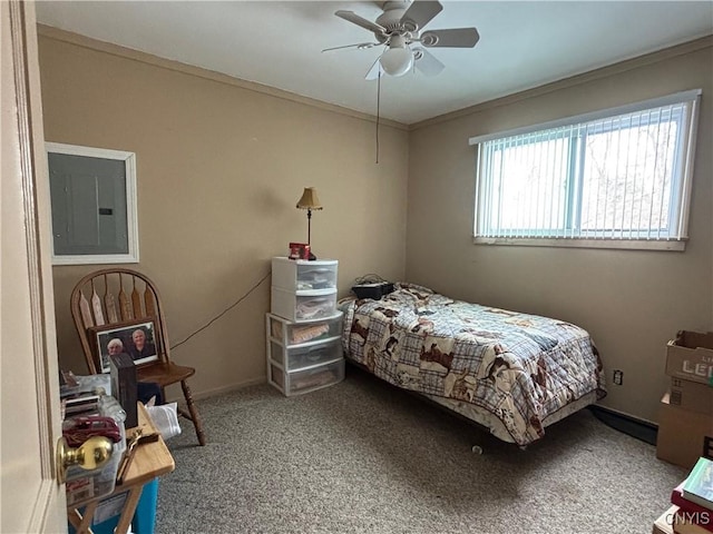 bedroom featuring ceiling fan, carpet floors, baseboards, ornamental molding, and electric panel