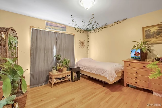 bedroom with light wood-style floors