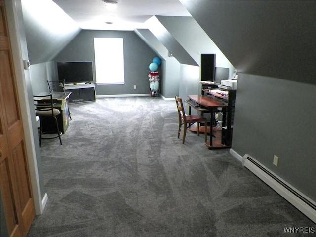 carpeted office with a baseboard heating unit, lofted ceiling, and baseboards