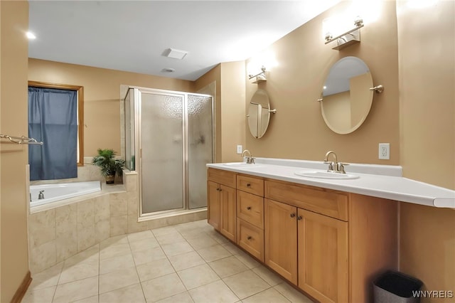 full bath with a garden tub, a sink, a shower stall, tile patterned flooring, and double vanity