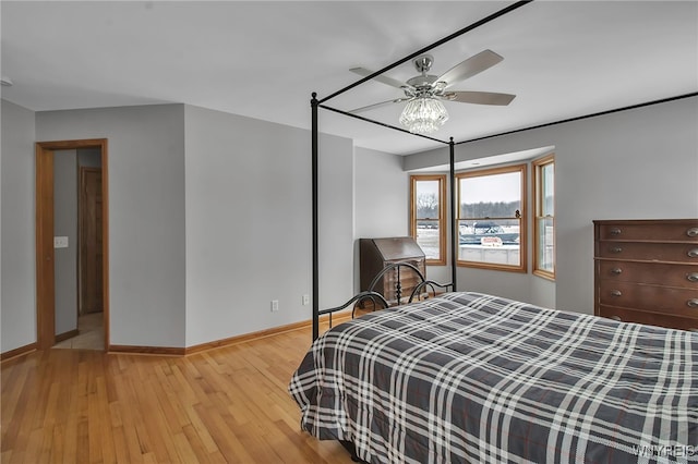 bedroom featuring baseboards and light wood-style floors