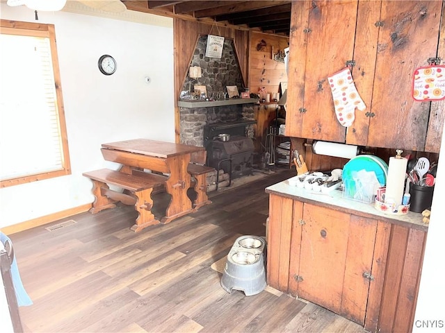 interior space with wood finished floors and visible vents