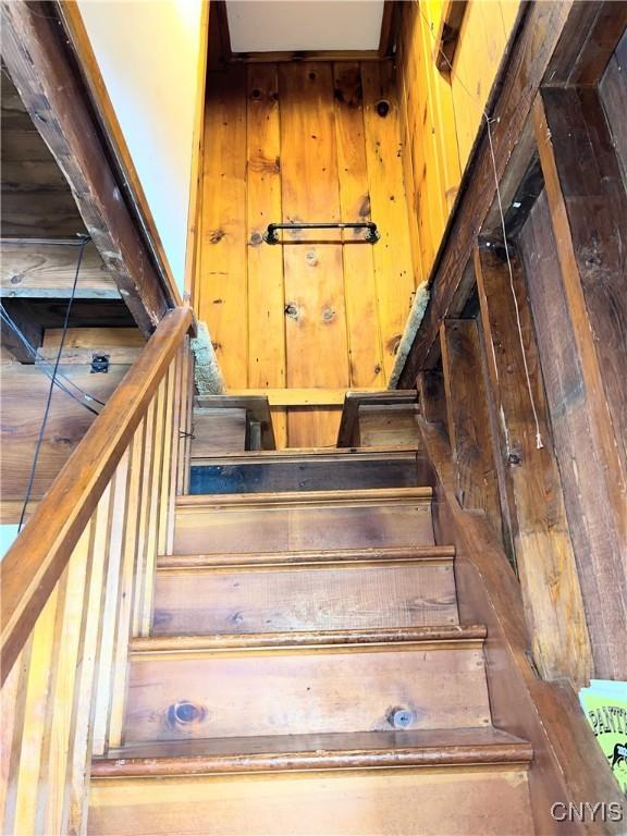 stairway with wooden walls